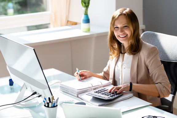 Professional accountant woman in office doing accounting and budget